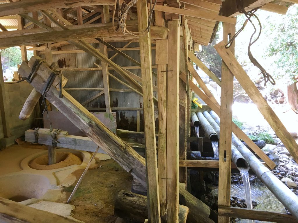 Traditional water-powered wooden kara-usu in Onta