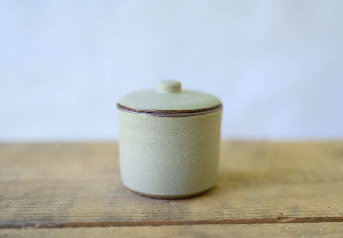 Small lidded ceramic container with a pale glaze by Celeste Ortelee.