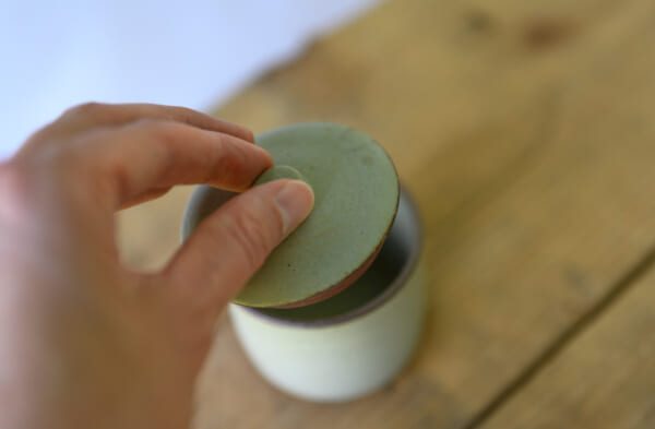 Small lidded container in cream